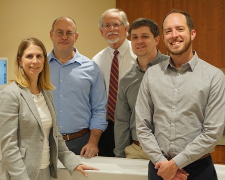 A five-person diabetes research team poses in an MRI exam room at VUMC.