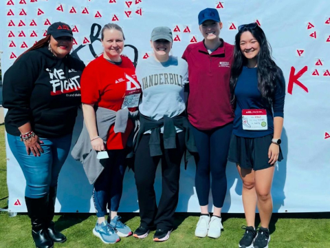 Five VDRC members in workout clothes pose after participating in the Step Out Walk.